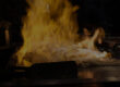Guests seated around a hibachi grill during an at-home hibachi catering event