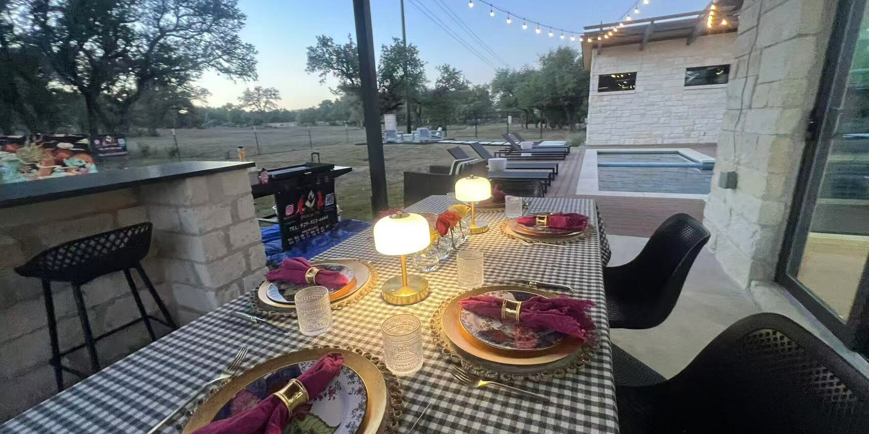 Covered patio dining setup prepared for an at-home hibachi party with table settings and outdoor seating