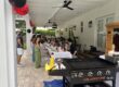Covered patio hibachi party setup with grill and guest seating for indoor vs outdoor at-home event planning