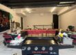 Private hibachi chef cooking classic menu dishes on the grill at an at-home dinner party
