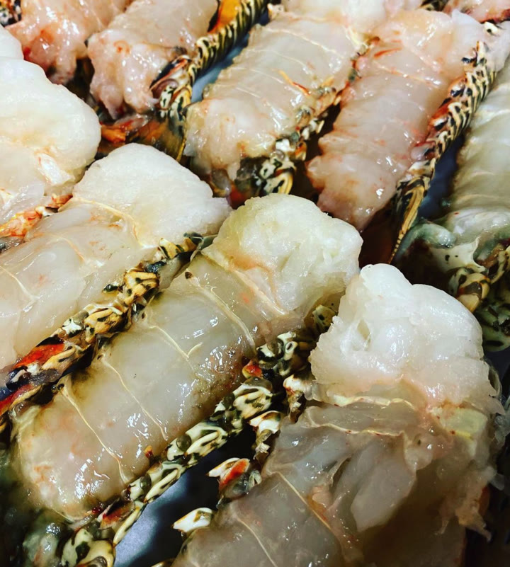 Butterflied lobster tails prepared for a Hibachi Royal signature teppanyaki course