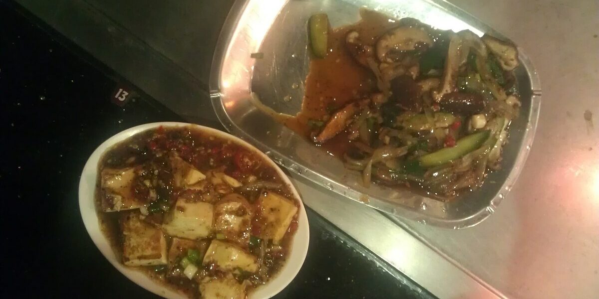 Vegetarian teppanyaki set meal with mushrooms and tofu grilled at an at-home hibachi party