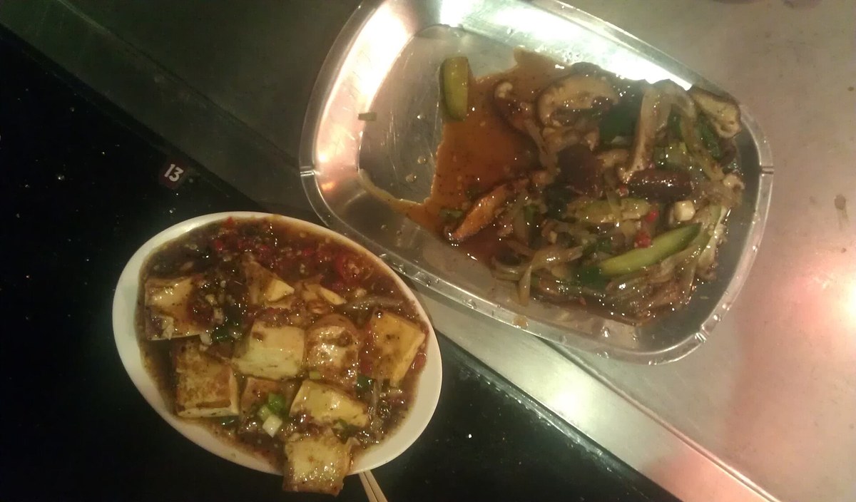 Vegetarian teppanyaki set meal with mushrooms and tofu grilled at an at-home hibachi party