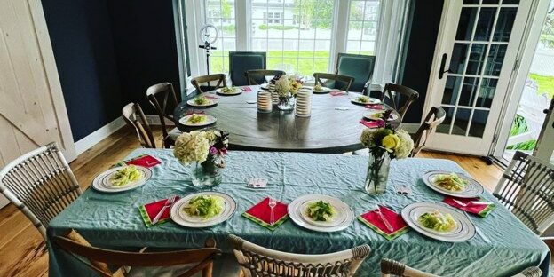Dining room table set with plates and glassware for a family dinner, from the Hibachi Royal gallery